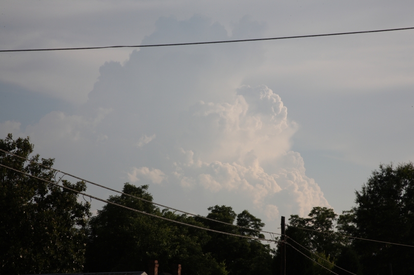 large cloud behind telephone lines